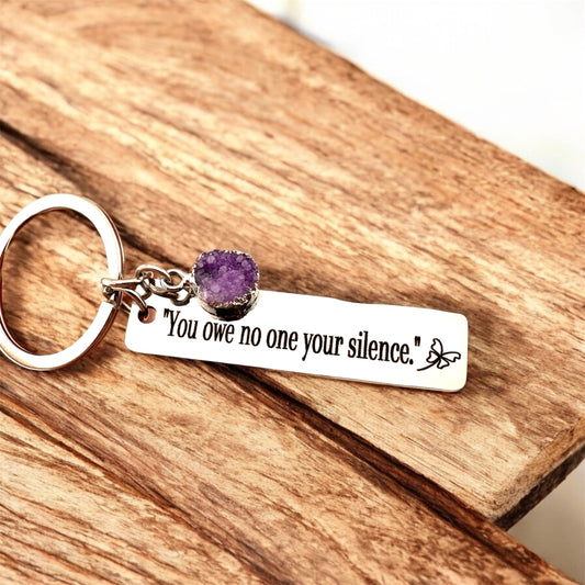 Domestic Violence Awareness Keychain – “You Owe No One Your Silence” Engraved Keychain with purple Charm | Survivor Gift | Healing Reminder.