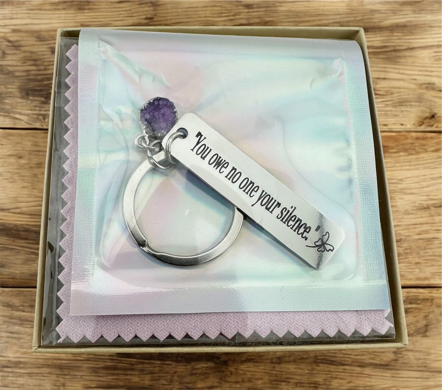 Domestic Violence Awareness Keychain – “You Owe No One Your Silence” Engraved Keychain with purple Charm | Survivor Gift | Healing Reminder.