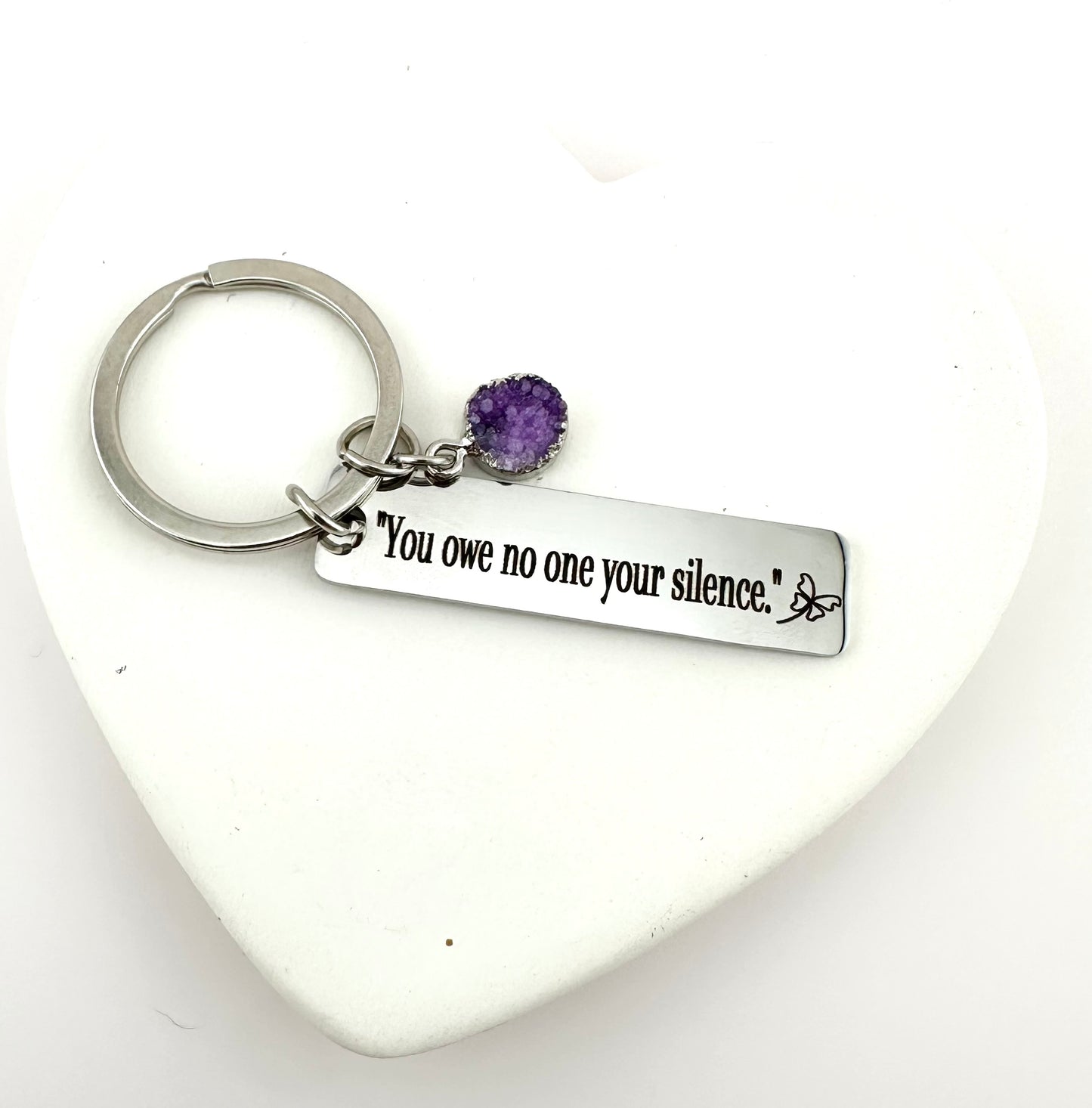 Domestic Violence Awareness Keychain – “You Owe No One Your Silence” Engraved Keychain with purple Charm | Survivor Gift | Healing Reminder.